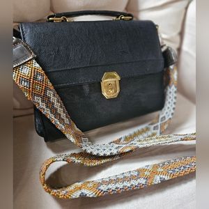 Crossbody belt for cameras or purses/bags.